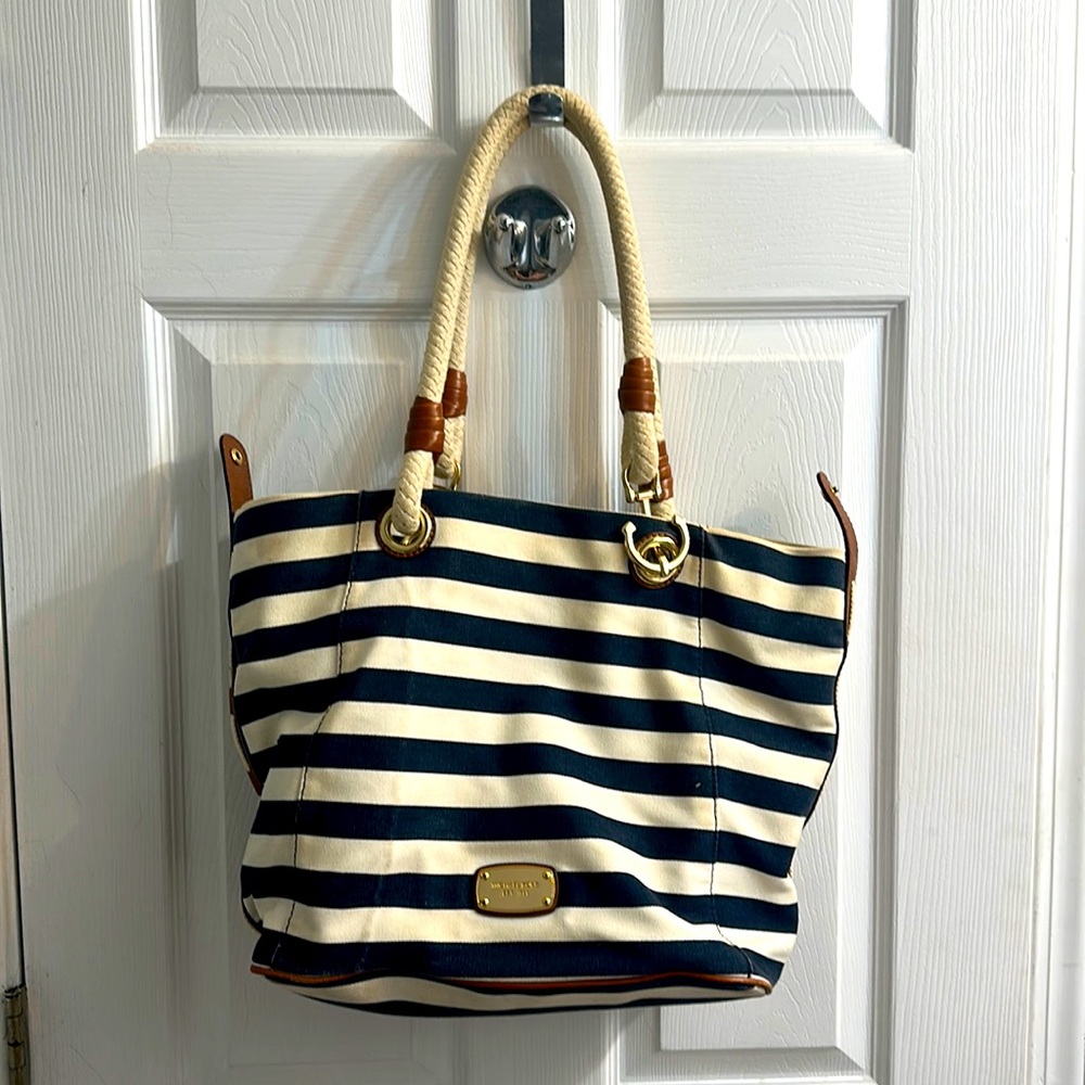 Michael Kors Marina blue and cream striped purse with anchor detail.